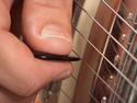 How to play pinch harmonics